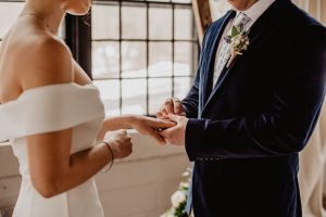 woman and man holding each others hands