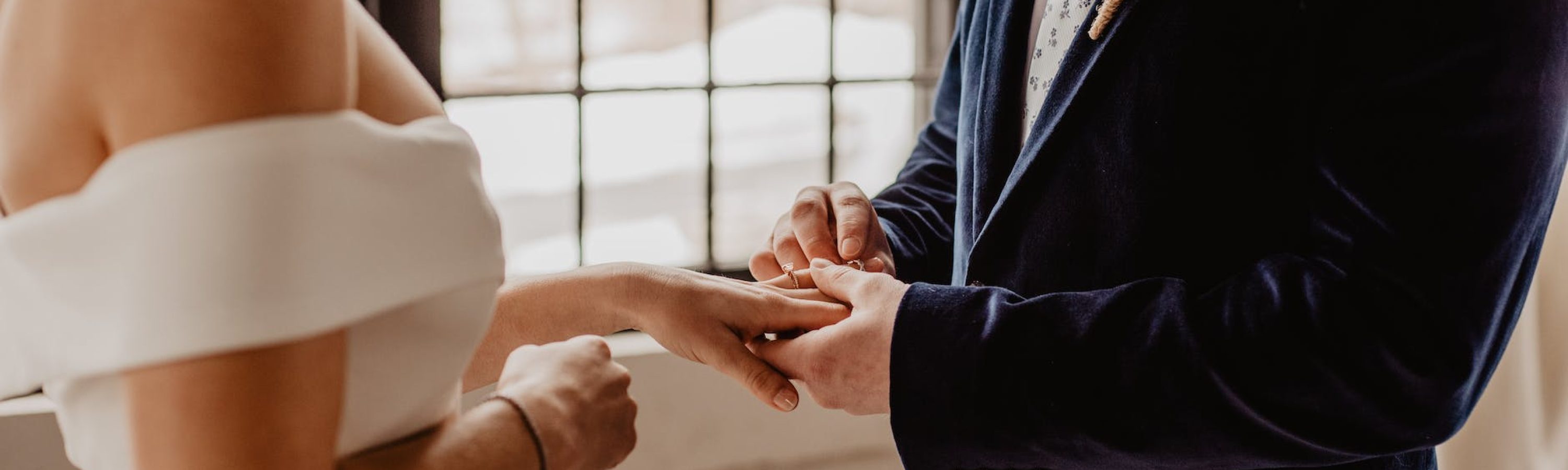 woman and man holding each others hands